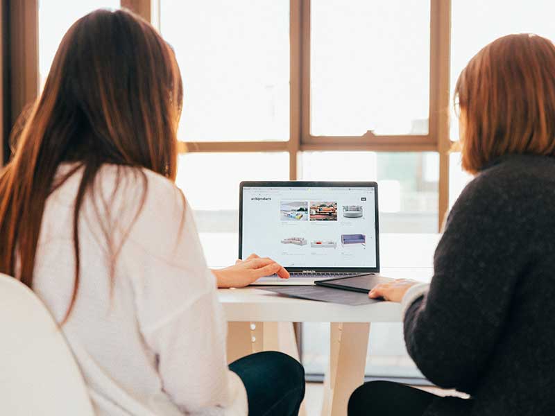 People looking at a computer