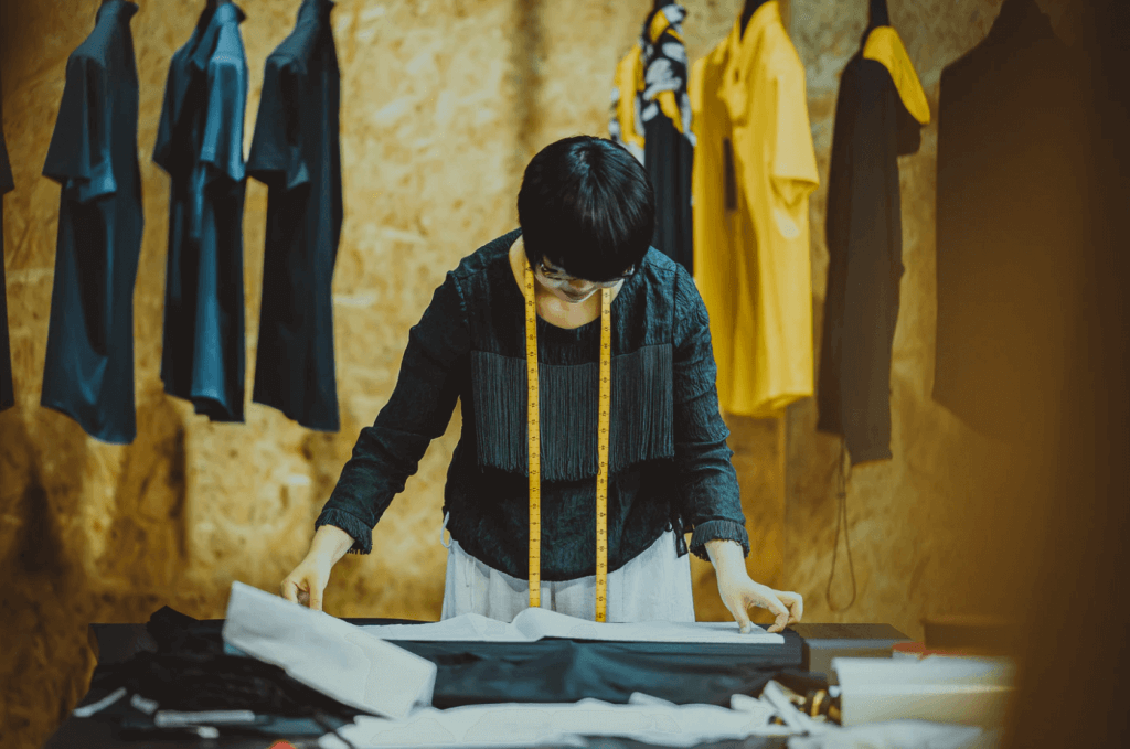 Women standing over clothing