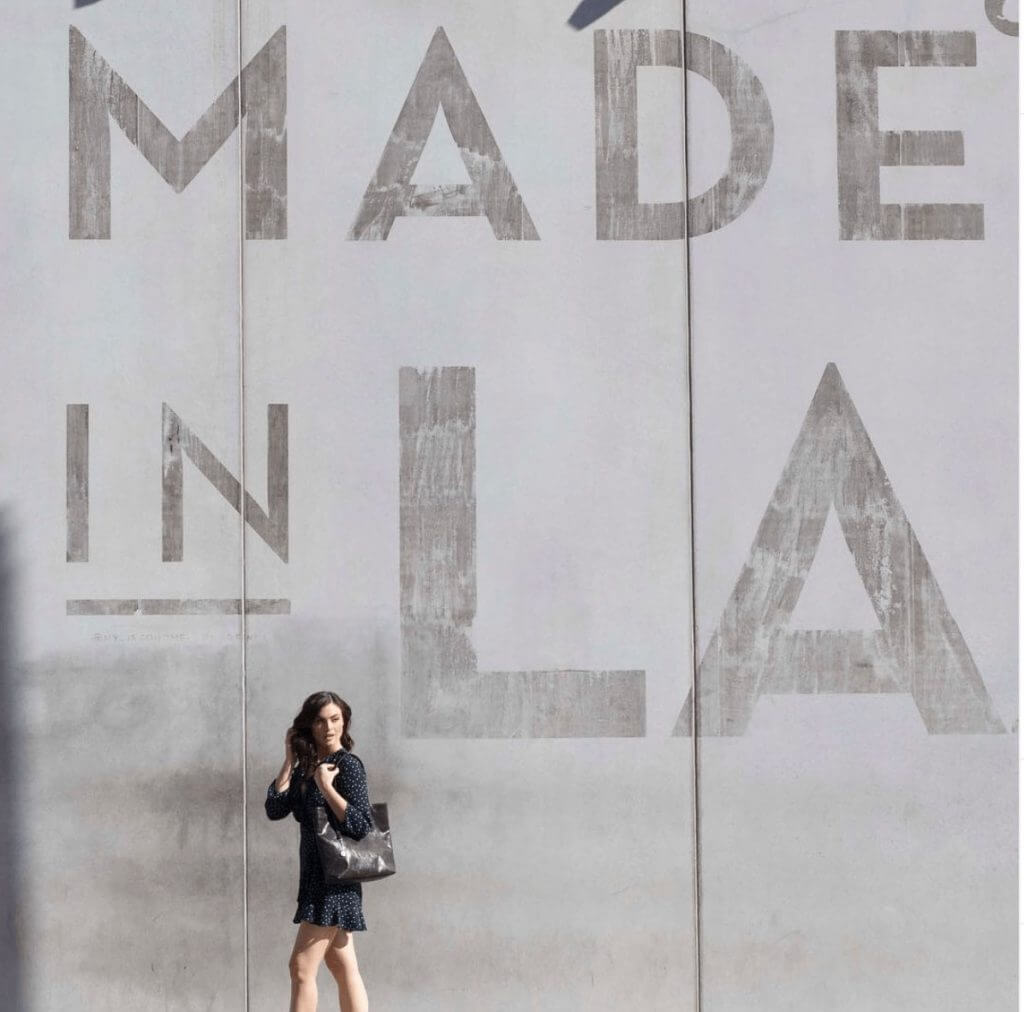 Woman standing in front of a wall