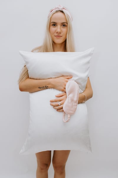 Woman holding Princess and Pea pillow